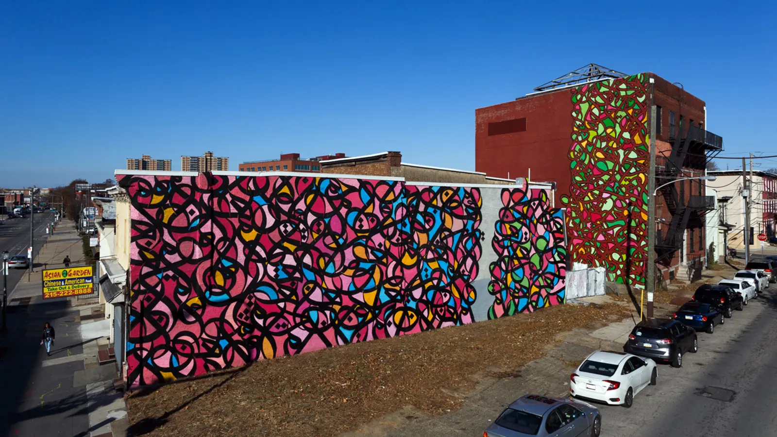 Artist El Seed and Mural Arts Use Iron Stone Building As Canvas